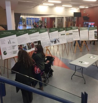 members of the public viewing displays at an open house