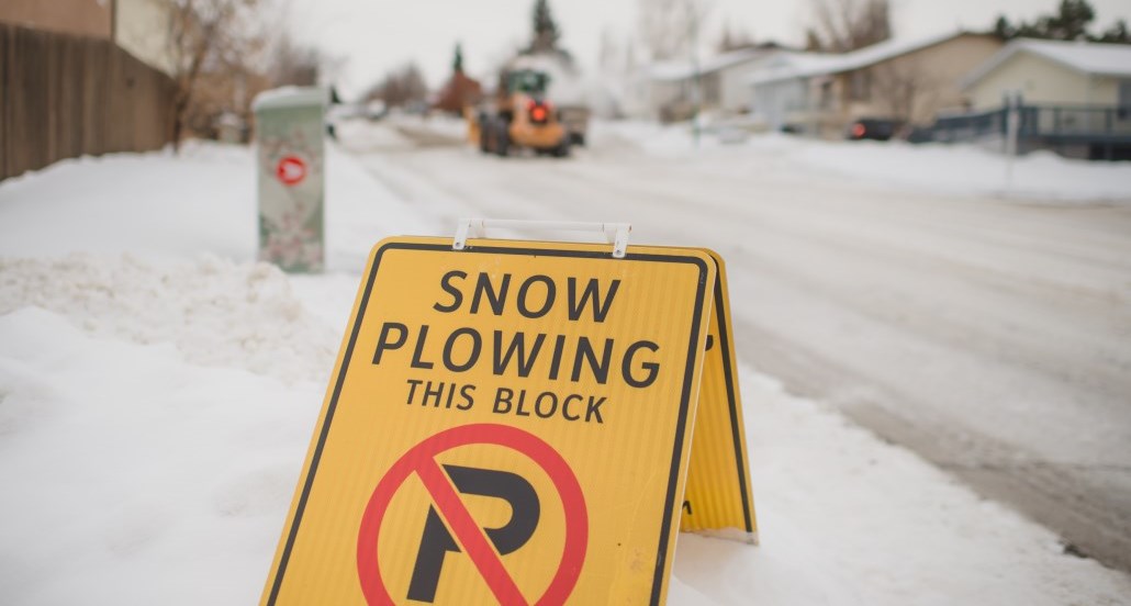 snow plowing no parking sign