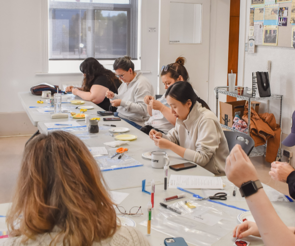 Beading students working in the Heritage room. 