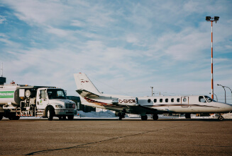 an airplane docked about to be fueled