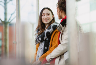 people talking in a bus stop