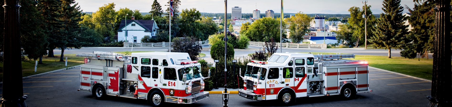 Fire Trucks parked outside with a view of Prince Albert