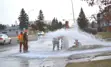 City crews working on a bursting fire hydrant